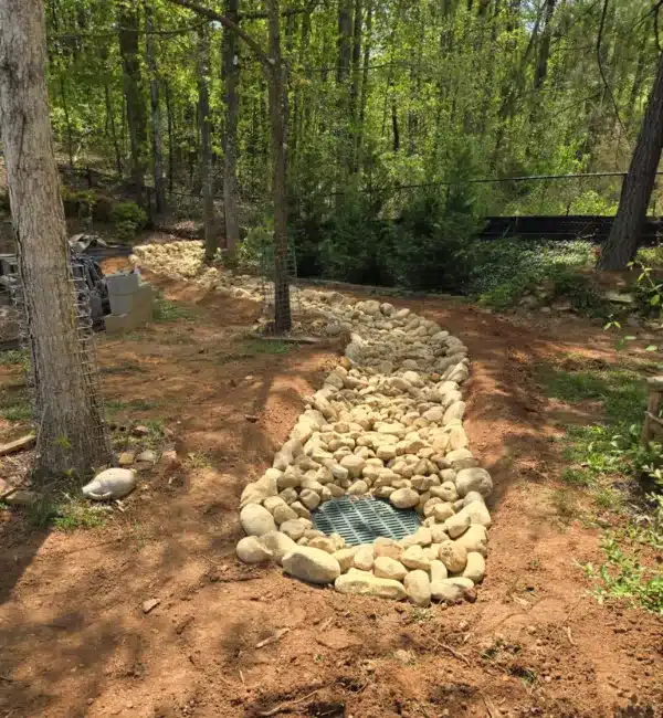 Dry Creek Bed With River Rock and Area Drain.